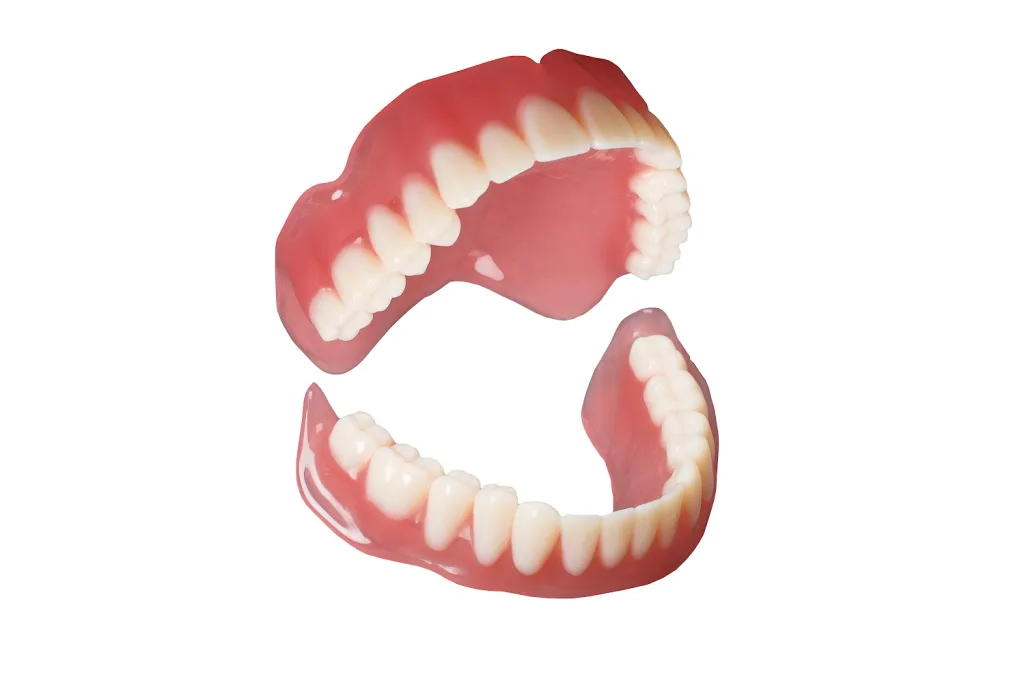 Dentures positioned like a jaw on top of each other